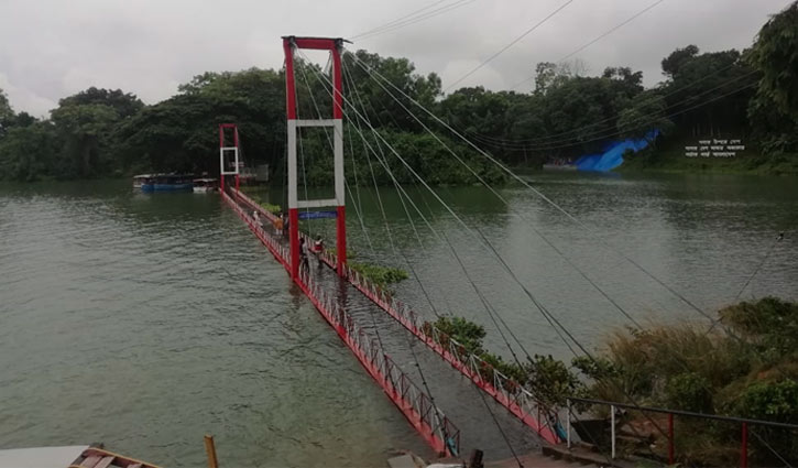 Rain submerges hanging bridge