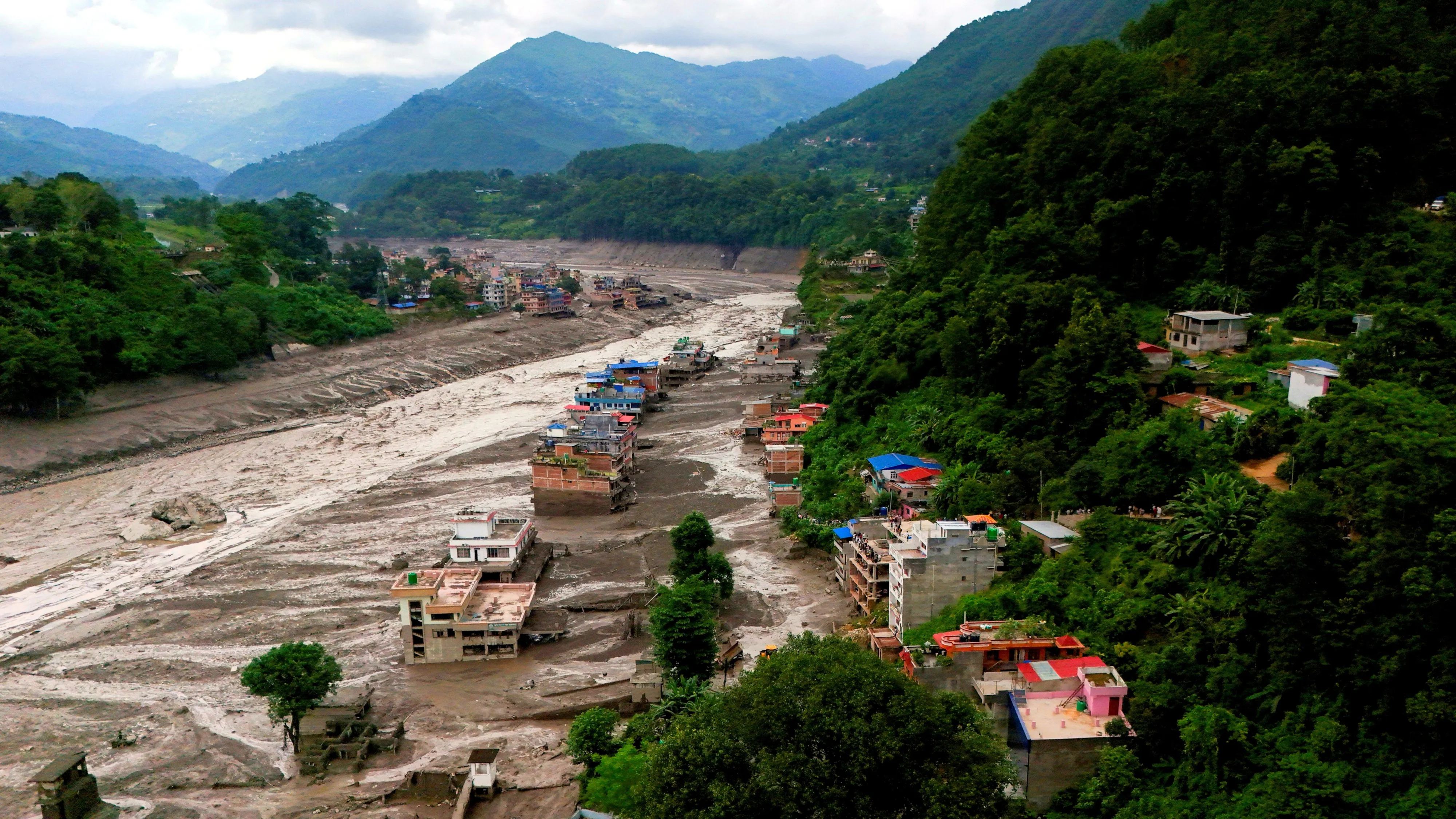 Flash floods, landslides leave hundreds killed, missing in Nepal-China